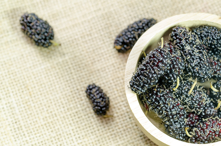 Closed up Mulberries in the bowl on the tableの写真素材