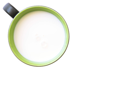 Top view of glass milk green and white in simple glass. Isolated on white background. Round copy space in center.の写真素材