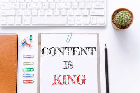 Text Content is king on white paper background / business conceptの写真素材