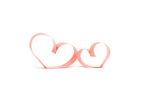 Valentines day card - heart made of ribbon on white background.の写真素材