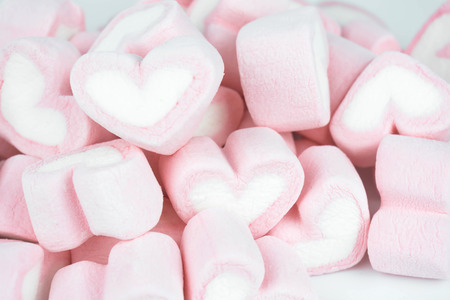 Candy hearts on a blue background / heart represents love in Valentine's Day / wedding day.