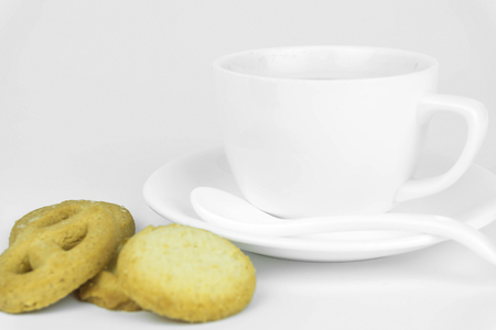 Coffee cup and candy on white background.の写真素材