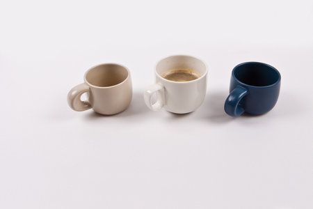 Two cups of coffee on a white background, close-up.の写真素材
