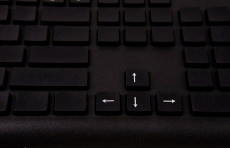 Keyboard of a computer with arrows pointing to the left and right