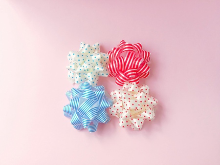 Cute bow ribbon are beautiful put in the middle on a pink background.