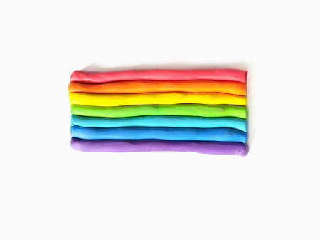 Rainbow color plasticine clay on white backgroundの写真素材