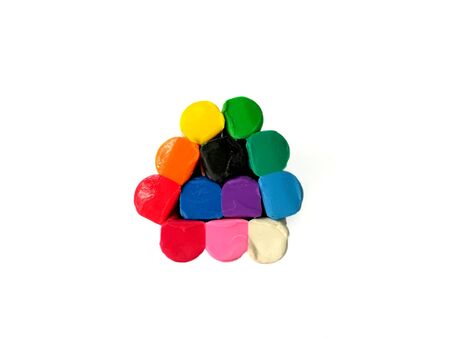 Colorful plasticine clay on white background