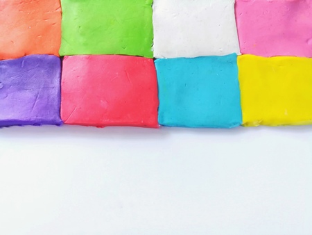 Colorful plasticine clay arranged color swap on white background, rectangle dough