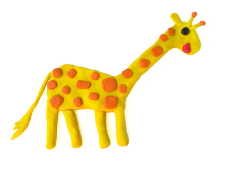 Cute yellow giraffe made from plasticine clay on white background,lovely long neck animal doughの写真素材