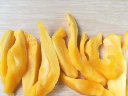 Jackfruit cut into strips on wooden background, delicious slice fruit