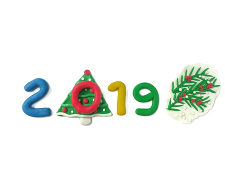 Colorful clay plasticine handmade are beautiful 2019 new year text decoration Christmas tree are arranged line horizontal on white background, happiness festival are doughの写真素材