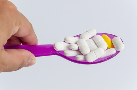 pills medicine in spoonの写真素材