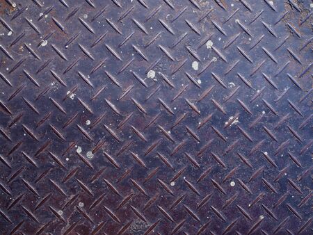 Old rusty dirty white painted stained scratched blue iron steel checker plate background, full of dustの写真素材