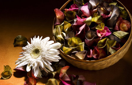  Basket filled with poturri sitting on a table a with dark background  Lighting to show texture and detail の写真素材