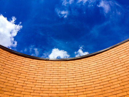 red brick wall and blue skyの写真素材
