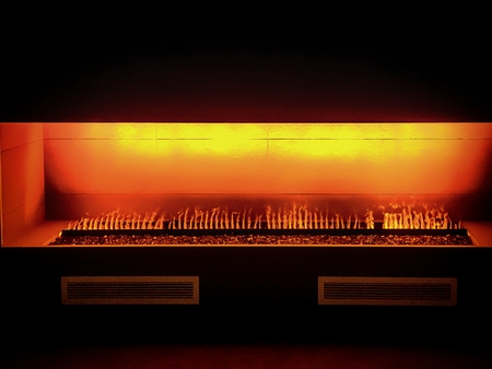 glowing orange fireplace in a modern settingの写真素材