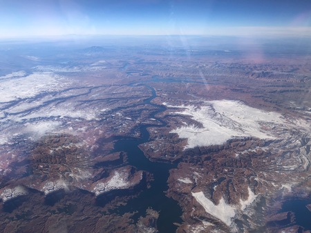 aerial view of the desert and snow-capped mountains in Coloradoの写真素材
