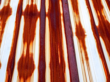 pattern of a rusty metal building wallの写真素材