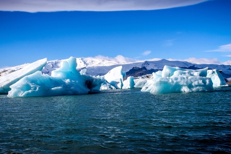 icebergs from Glacier floating in a lagoon in Iceland as a result of global warmingの写真素材