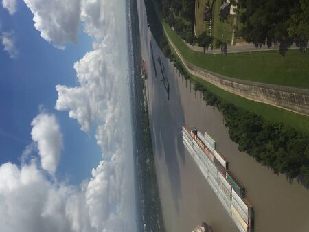 flying over Mississippi River cargo ships in Louisianaの写真素材