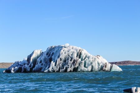 icebergs from Glacier floating in a lagoon in Iceland as a result of global warming