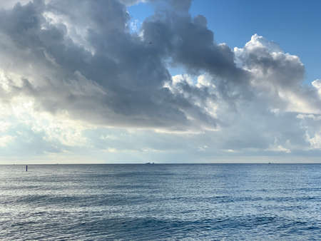 Ship on the ocean at sunset in the ocean.