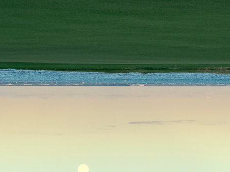 Reflection of the sun in the water of a lagoon in Sicilyの写真素材