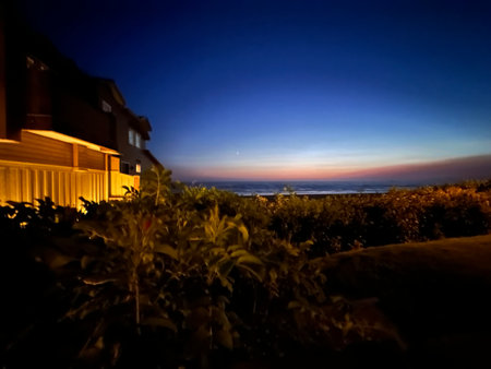 Beautiful view of the sea at sunset from the terrace of a houseの素材