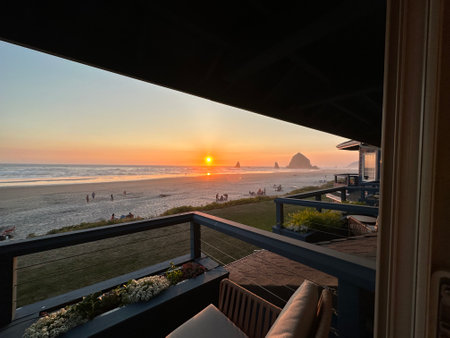 View from the terrace of a cafe on the beach at sunsetの素材