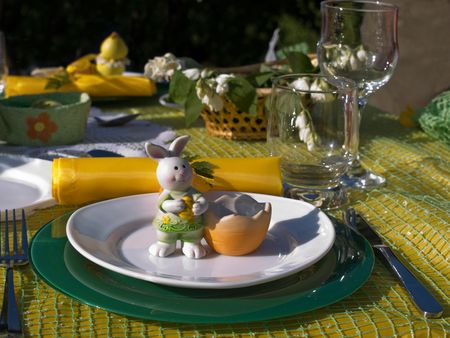 Table with tableware for dinner out of apartment