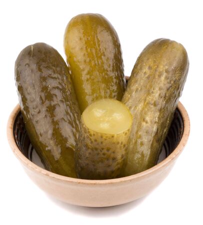 large pickled cucumbers on a ceramic dishの写真素材