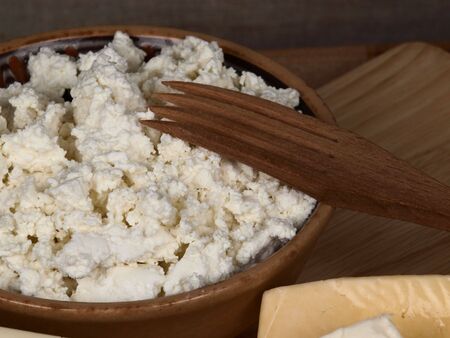 cottage cheese in a ceramic dish on a cook-tableの写真素材