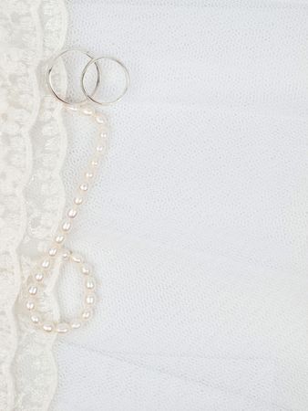 Two silver weddings rings on a background a laceの写真素材