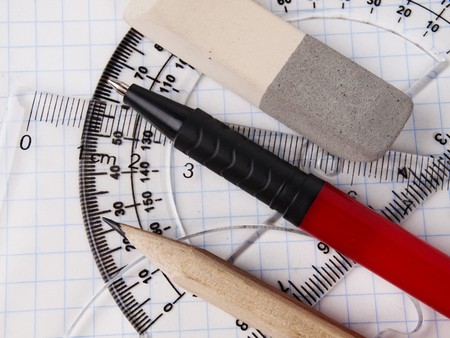 protractor, pen, pencil, rules and workbook page 