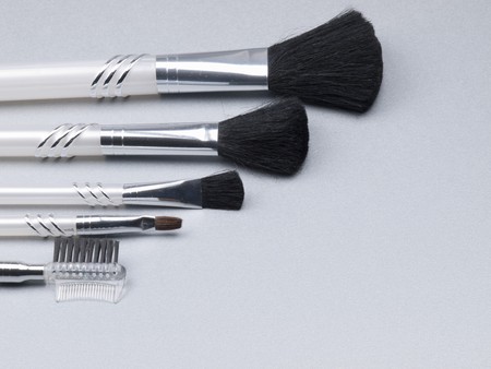 set of make-up brushes on a grey backgroundの写真素材