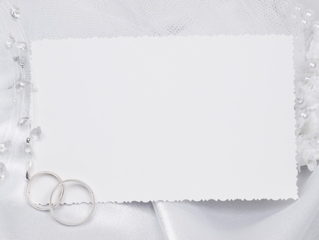 Silver wedding rings on a card の写真素材