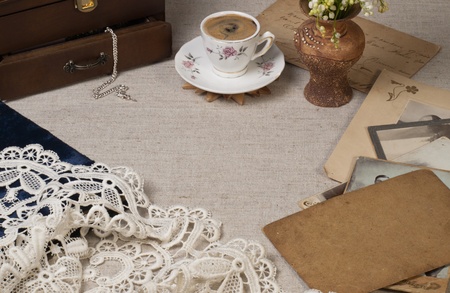 Still life with old pictures and cup of coffeeの写真素材