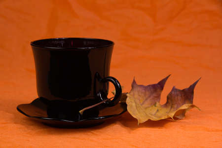 Coffee still life on an orange backgroundの写真素材
