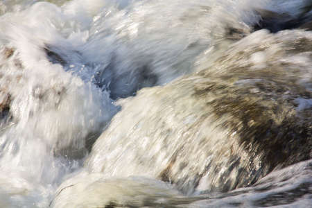 Water flowing over rocks.  Closeup.
