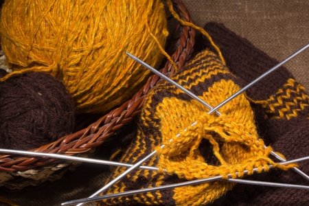 A basket with  knitting yarn and knitting needlesの写真素材