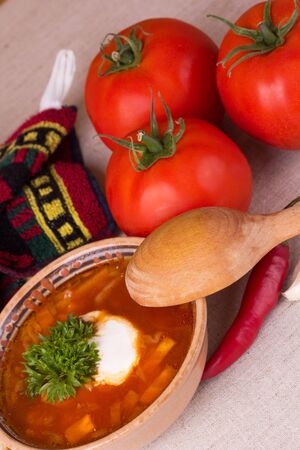 Ukrainian beetroot soup in ceramic bowl, decorated in a country styleの写真素材