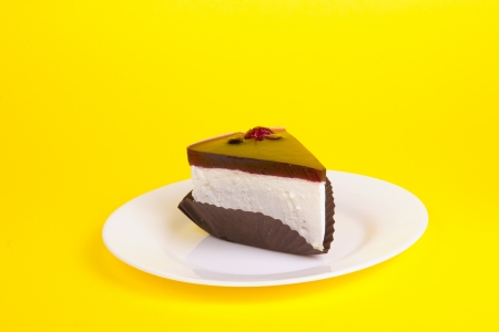 Piece of cake on the yellow backgroundの写真素材