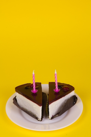 Piece of cake on the yellow backgroundの写真素材