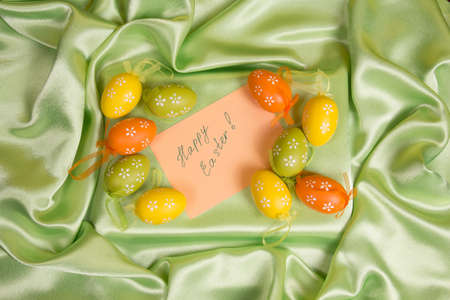 Colorful Easter eggs on a green  background