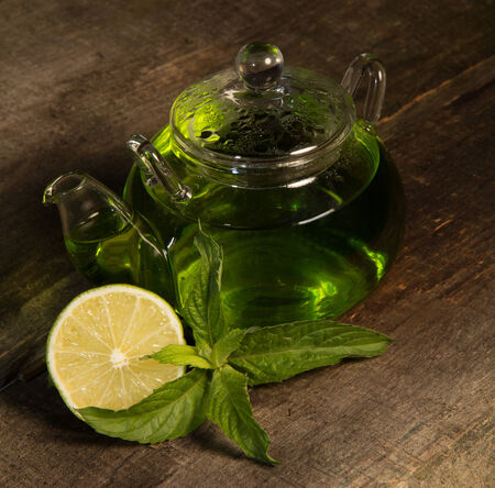 Herbal tea on the kitchen table.  Low key presentationの写真素材