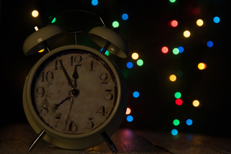 Christmas background with vintage alarm clock close up