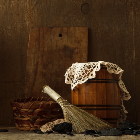 Still life with vintage tools for cleaning  and charcoalの写真素材