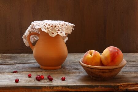 Rustic style still life with ripe peachesの写真素材