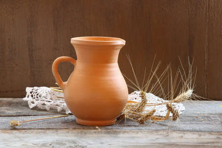 Rustic style still life with ears of wheatの写真素材