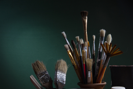 Various artist  brushes on the green backgroundの写真素材